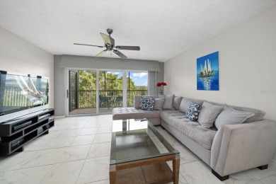 Enjoy Effortless Condo Living with Golf Course Views! Welcome to on East Bay Golf Club in Florida - for sale on GolfHomes.com, golf home, golf lot