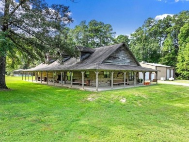 Nestled on 21 picturesque acres, this 4-bedroom, 3-bath rustic on Rayburn Country Club in Texas - for sale on GolfHomes.com, golf home, golf lot