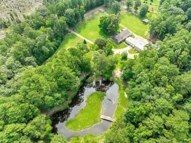 Nestled on 21 picturesque acres, this 4-bedroom, 3-bath rustic on Rayburn Country Club in Texas - for sale on GolfHomes.com, golf home, golf lot