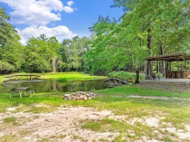 Nestled on 21 picturesque acres, this 4-bedroom, 3-bath rustic on Rayburn Country Club in Texas - for sale on GolfHomes.com, golf home, golf lot