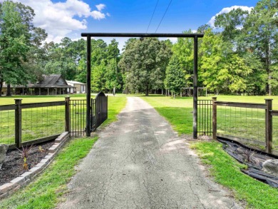 Nestled on 21 picturesque acres, this 4-bedroom, 3-bath rustic on Rayburn Country Club in Texas - for sale on GolfHomes.com, golf home, golf lot