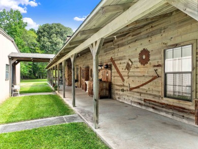 Nestled on 21 picturesque acres, this 4-bedroom, 3-bath rustic on Rayburn Country Club in Texas - for sale on GolfHomes.com, golf home, golf lot