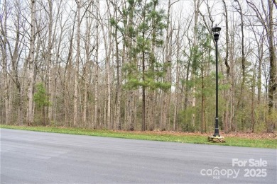 This Badin Lake waterfront lot is located in the prestigious on Old North State Club at Uwharrie Point Golf community in North Carolina - for sale on GolfHomes.com, golf home, golf lot