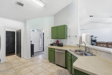 Beautiful and well-maintained 4-bedroom, 2-bath home located in on Palm Harbor Golf Club in Florida - for sale on GolfHomes.com, golf home, golf lot