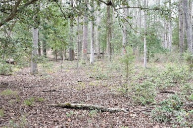 This Badin Lake waterfront lot is located in the prestigious on Old North State Club at Uwharrie Point Golf community in North Carolina - for sale on GolfHomes.com, golf home, golf lot