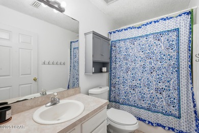 Beautiful and well-maintained 4-bedroom, 2-bath home located in on Palm Harbor Golf Club in Florida - for sale on GolfHomes.com, golf home, golf lot