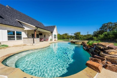 This beautifully designed home offers a private entrance to the on Cedar Creek Country Club in Texas - for sale on GolfHomes.com, golf home, golf lot