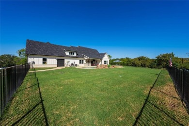 This beautifully designed home offers a private entrance to the on Cedar Creek Country Club in Texas - for sale on GolfHomes.com, golf home, golf lot