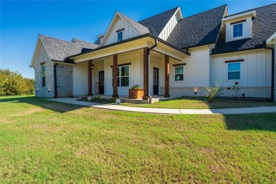 This beautifully designed home offers a private entrance to the on Cedar Creek Country Club in Texas - for sale on GolfHomes.com, golf home, golf lot