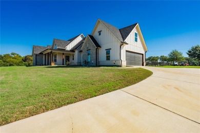 This beautifully designed home offers a private entrance to the on Cedar Creek Country Club in Texas - for sale on GolfHomes.com, golf home, golf lot