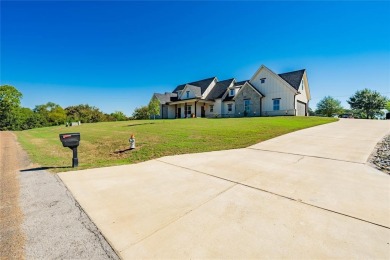 This beautifully designed home offers a private entrance to the on Cedar Creek Country Club in Texas - for sale on GolfHomes.com, golf home, golf lot