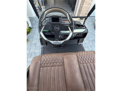 Ride in Style! This home includes a premium Atlas six-seater on Babcock National Golf Course in Florida - for sale on GolfHomes.com, golf home, golf lot