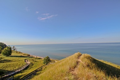 Welcome to your dream home-an exquisite retreat perfectly on Muskegon Country Club in Michigan - for sale on GolfHomes.com, golf home, golf lot