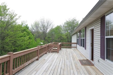 This is a Golfer's Dream, an awesome large deck overlooking on Bella Vista - Metfield Golf Complex and Country Club in Arkansas - for sale on GolfHomes.com, golf home, golf lot