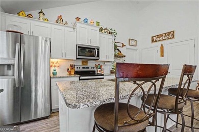 Enjoy peaceful living in this charming 2-bedroom, 2-bath home on The Highlands Course at Lake Arrowhead in Georgia - for sale on GolfHomes.com, golf home, golf lot