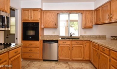 This Bright, Cheerful, & Upgraded Open-Plan Home is Tucked Away on Sunland Village East Golf Course in Arizona - for sale on GolfHomes.com, golf home, golf lot