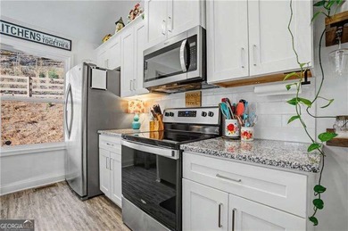 Enjoy peaceful living in this charming 2-bedroom, 2-bath home on The Highlands Course at Lake Arrowhead in Georgia - for sale on GolfHomes.com, golf home, golf lot