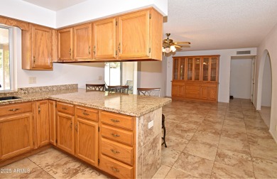 This Bright, Cheerful, & Upgraded Open-Plan Home is Tucked Away on Sunland Village East Golf Course in Arizona - for sale on GolfHomes.com, golf home, golf lot