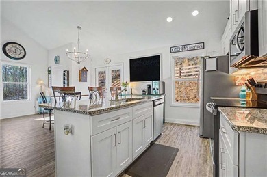 Enjoy peaceful living in this charming 2-bedroom, 2-bath home on The Highlands Course at Lake Arrowhead in Georgia - for sale on GolfHomes.com, golf home, golf lot