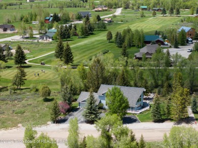 Step into a meticulously maintained interior boasting 4 bedrooms on Cedar Creek Golf Course in Wyoming - for sale on GolfHomes.com, golf home, golf lot