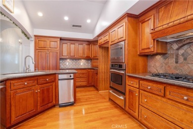 This beautiful home is nestled amidst gently rolling hills in on Vista Valencia Golf Course in California - for sale on GolfHomes.com, golf home, golf lot