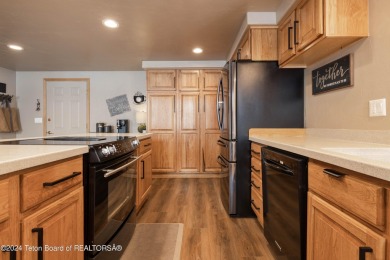 Step into a meticulously maintained interior boasting 4 bedrooms on Cedar Creek Golf Course in Wyoming - for sale on GolfHomes.com, golf home, golf lot