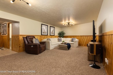 Step into a meticulously maintained interior boasting 4 bedrooms on Cedar Creek Golf Course in Wyoming - for sale on GolfHomes.com, golf home, golf lot