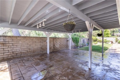 This beautiful home is nestled amidst gently rolling hills in on Vista Valencia Golf Course in California - for sale on GolfHomes.com, golf home, golf lot