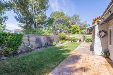 This beautiful home is nestled amidst gently rolling hills in on Vista Valencia Golf Course in California - for sale on GolfHomes.com, golf home, golf lot