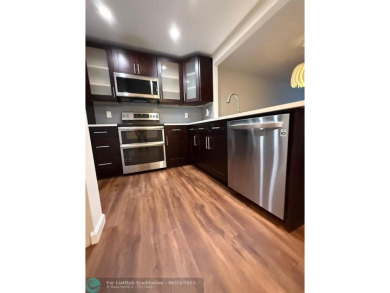 Experience the best of Pine Island Ridge in this spacious on Pine Island Ridge Country Club in Florida - for sale on GolfHomes.com, golf home, golf lot