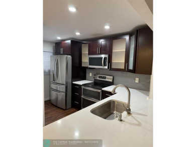 Experience the best of Pine Island Ridge in this spacious on Pine Island Ridge Country Club in Florida - for sale on GolfHomes.com, golf home, golf lot
