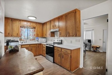 Run! Because this house is all that and a bag of chips! (If you on Mt. Graham Municipal Golf Course in Arizona - for sale on GolfHomes.com, golf home, golf lot