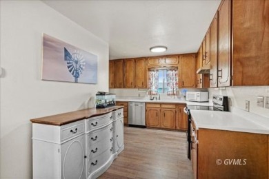 Run! Because this house is all that and a bag of chips! (If you on Mt. Graham Municipal Golf Course in Arizona - for sale on GolfHomes.com, golf home, golf lot