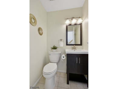 Experience elevated living in this sun-drenched, end-unit on Echo Lake Country Club in New Jersey - for sale on GolfHomes.com, golf home, golf lot