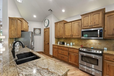 This stunning home offers timeless craftsmanship, luxurious on The Coves Golf Course in Oklahoma - for sale on GolfHomes.com, golf home, golf lot
