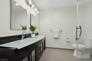 Experience elevated living in this sun-drenched, end-unit on Echo Lake Country Club in New Jersey - for sale on GolfHomes.com, golf home, golf lot