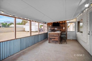 Run! Because this house is all that and a bag of chips! (If you on Mt. Graham Municipal Golf Course in Arizona - for sale on GolfHomes.com, golf home, golf lot