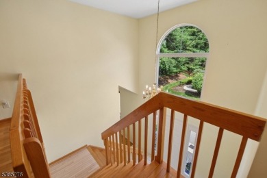 Experience elevated living in this sun-drenched, end-unit on Echo Lake Country Club in New Jersey - for sale on GolfHomes.com, golf home, golf lot