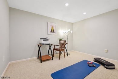 Experience elevated living in this sun-drenched, end-unit on Echo Lake Country Club in New Jersey - for sale on GolfHomes.com, golf home, golf lot