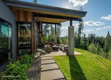 Spectacular custom-built home with beautiful views of Lake Coeur on Gozzer Ranch Golf and Lake Club in Idaho - for sale on GolfHomes.com, golf home, golf lot