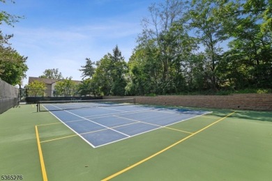 Experience elevated living in this sun-drenched, end-unit on Echo Lake Country Club in New Jersey - for sale on GolfHomes.com, golf home, golf lot