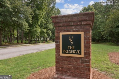 Experience luxury living at its finest in this stunning on The Golf Club At Sanctuary Cove in Georgia - for sale on GolfHomes.com, golf home, golf lot