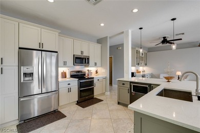 Beautifully updated single-family home located in the gated on Gateway Golf and Country Club in Florida - for sale on GolfHomes.com, golf home, golf lot