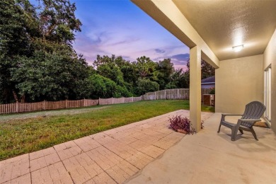 SCENIC. SPACIOUS. SERENEe visit this 4-bedroom, 2.5-bath home on on Meadow Oaks Golf and Country Club in Florida - for sale on GolfHomes.com, golf home, golf lot
