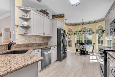 Enjoy breathtaking lake and golf course views from this on Monarch Country Club in Florida - for sale on GolfHomes.com, golf home, golf lot