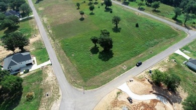 Beautiful sunsets and open water views from this corner lot on Cedar Creek Country Club in Texas - for sale on GolfHomes.com, golf home, golf lot