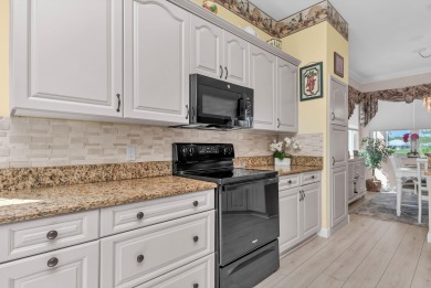 Enjoy breathtaking lake and golf course views from this on Monarch Country Club in Florida - for sale on GolfHomes.com, golf home, golf lot