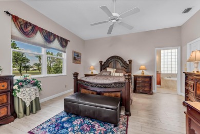 Enjoy breathtaking lake and golf course views from this on Monarch Country Club in Florida - for sale on GolfHomes.com, golf home, golf lot