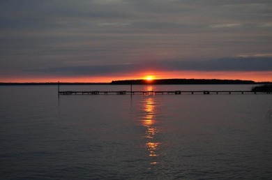 Beautiful sunsets and open water views from this corner lot on Cedar Creek Country Club in Texas - for sale on GolfHomes.com, golf home, golf lot