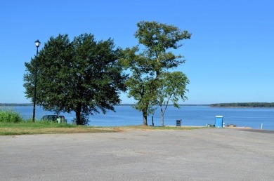 Beautiful sunsets and open water views from this corner lot on Cedar Creek Country Club in Texas - for sale on GolfHomes.com, golf home, golf lot